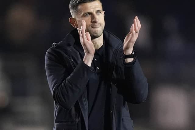 John Mousinho applauds the fans