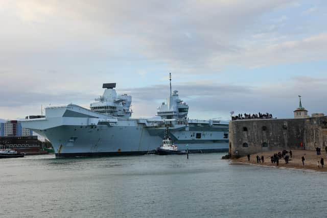 HMS Prince of Wales departing from Portsmouth Harbour.