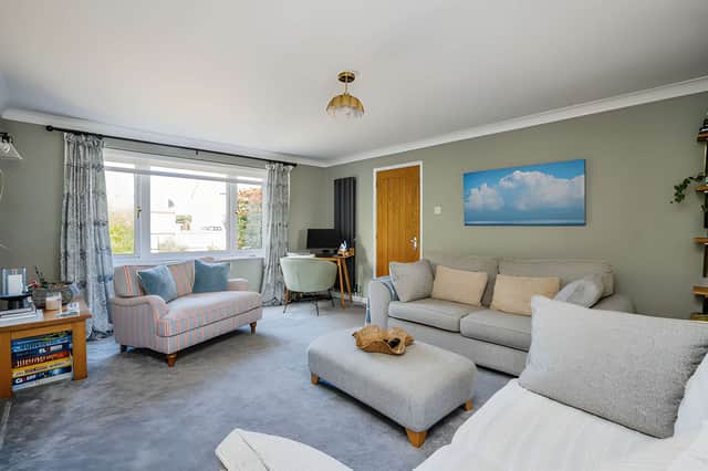 The home's flexible layout offers space for family living, with five bedrooms and an additional room that could become a home office, gym or hobby space