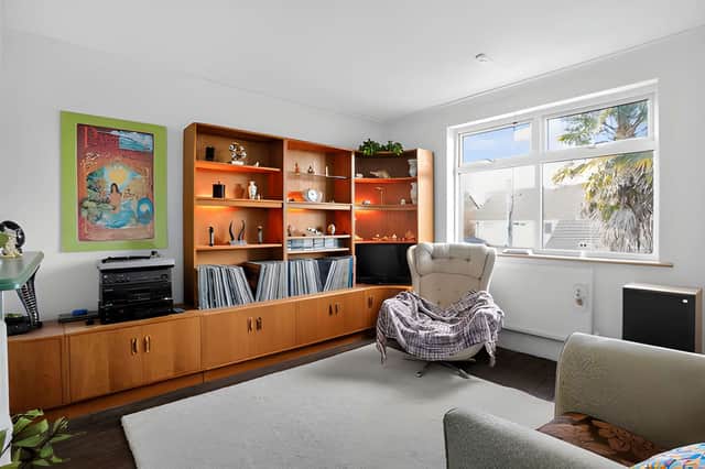 A spacious lounge provides a dedicated living area, with a separate dining room offering another place to gather with family and friends