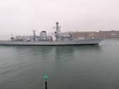 Retired Type 23 frigate HMS Iron Duke being towed to HMNB Portsmouth ahead of the prospect of being scrapped.