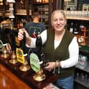 Landlady Ally Wearn pouring a pint on Tuesday, October20.

