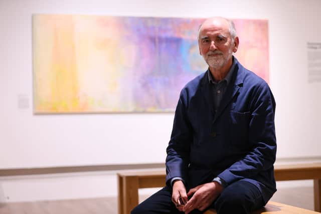 Artist Sir Christopher Le Brun, who grew up in the city, with his painting 'Phases of the Moon VII' which he has donated to the Museum and Art Gallery. Preview of Portsmouth100 Exhibition, Portsmouth Museum and Art Gallery, Museum Road, Portsmouth 
Picture: Chris Moorhouse (211026-032)