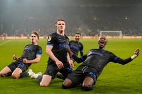 Goalscorer Terry Devlin, centre, with Eoin Kenny, Odin Bailey and Jojo Dia celebrate Pompey's equaliser at Wolves in front of the away end at Molineux.