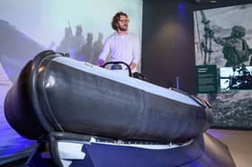 JJ Chalmers, presenter and former Royal Marine, trying out the rib inside the Royal Marines Experience at Portsmouth Historic Dockyard ahead of its public opening on Saturday. Veterans praised the new attraction. 