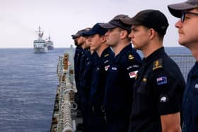 Royal Navy sailors have been conducting war games in the South China Sea despite previously threats from Beijing. Pictured: Royal Navy and Royal New Zealand sailors stand to attention on HMS Tamar’s flight deck.