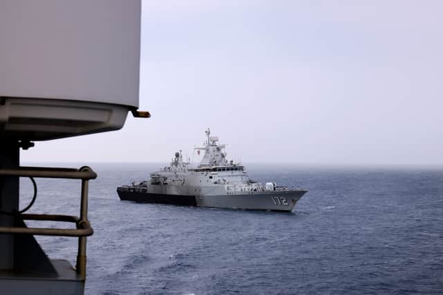 Malaysian ship KD Pahang sails past HMS Tamar. The end of the Sea Phase of Exercise Bersama Lima is marked with a traditional Sail Past, giving the participating crews the opportunity to wave goodbye.