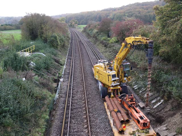 Workers planting a signal post with a piling rig as part of the rail upgrade near Petersfield Railway Station 
Picture: Habibur Rahman