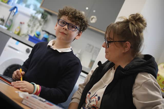Parker Hull, aged 9, with his mum Danielle Balchin, in The Quay at St George’s CofE Primary School, Portsea