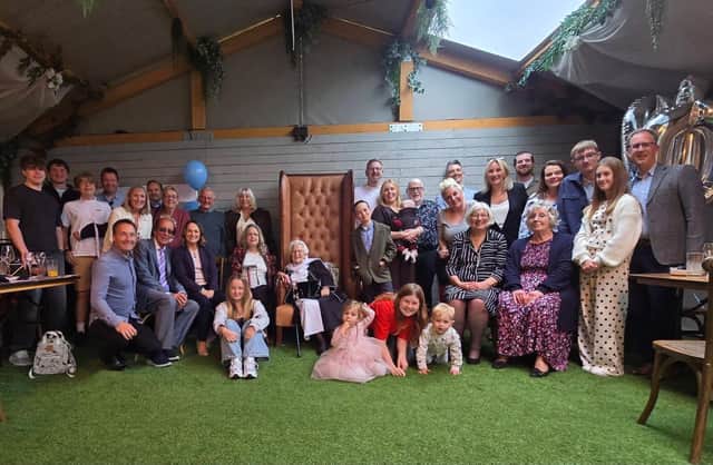 Eileen with family and friends on her 100th birthday.