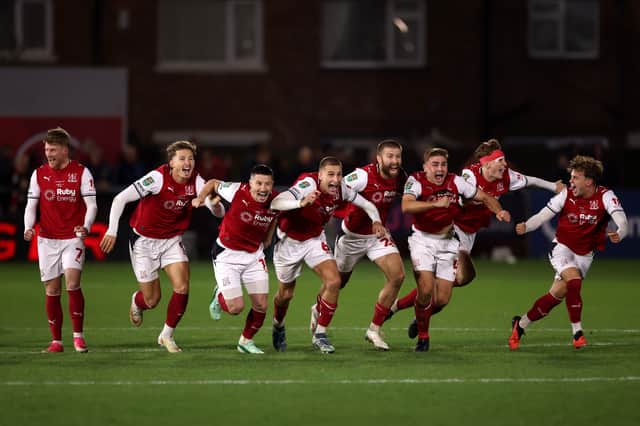 Former Pompey midfielder Andy Cannon and his Fleetwood team-mates celebrate victory over Arsenal. Pic: Getty