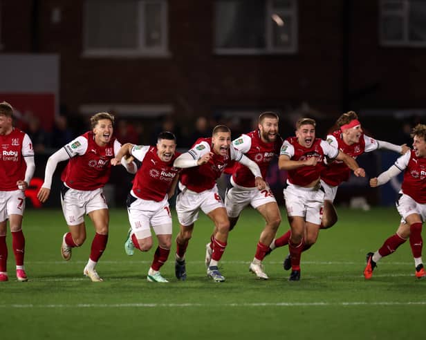 Former Pompey midfielder Andy Cannon and his Fleetwood team-mates celebrate victory over Arsenal. Pic: Getty
