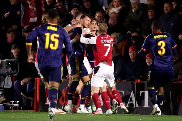 Former Pompey midfielder Andy Cannon gets involved with a skirmish with Arsenal. Pic: Getty