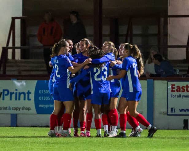 The Pompey Women players congratulate Kerry Beattie for her first-minute winner against Bournemouth
