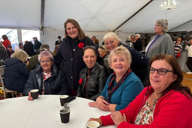 Alexsis Seed and some of the volunteers who helped to sew the poppies onto the display

Seated from L-R: Gina Anthony, Elsie Worrall, Vilma Cooke, Colleen Beattie,
