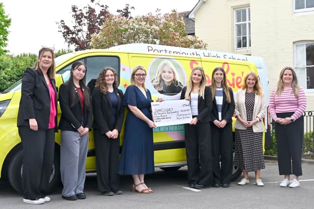 The outgoing Head Girl team at Portsmouth High hand over a cheque to Sophie's Legacy