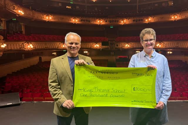Richard Pearce CEO of Portsmouth theatres accepting a cheque from Alice Lawrie - from Waitrose Southsea. Funding Bursaries for PTAA as part of their local Community Matters Fundraising Initiative