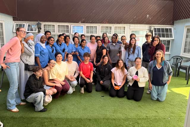 Students and teachers from Marie Le Franc Vocational High School, Lorient, together with staff from Cosham Court Nursing Home, during a memorable intergenerational visit