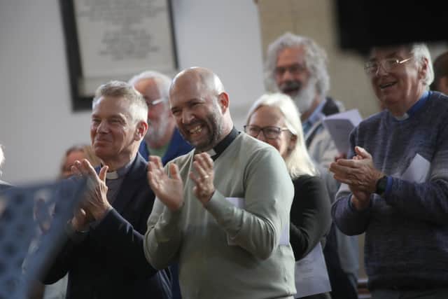 The congregation welcomes Mack Deptula's arrival in St Peter and St Paul's Church, Fareham