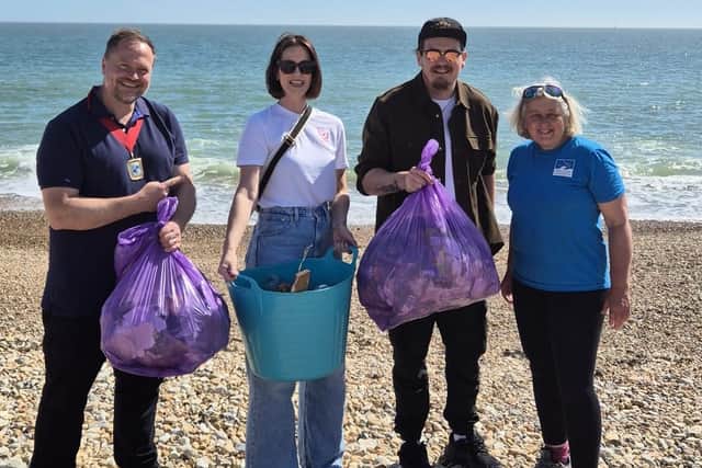 Councillor Mark Coates joins Danielle and Michael from boxChilli and Helen from Final Straw Foundation after the Eastoke Beach clean, proudly showing the litter they helped remove from Hayling’s shoreline.