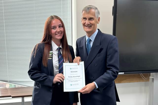 Sasha, Year 10 at HTC proudly receives her certificate.