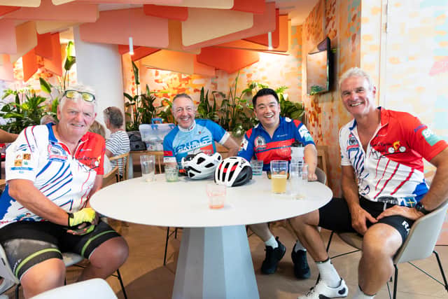 Alan Mak MP (second from right) and fellow riders enjoy a well-earned drink after arriving in Paris during the Hayling Cycle Ride