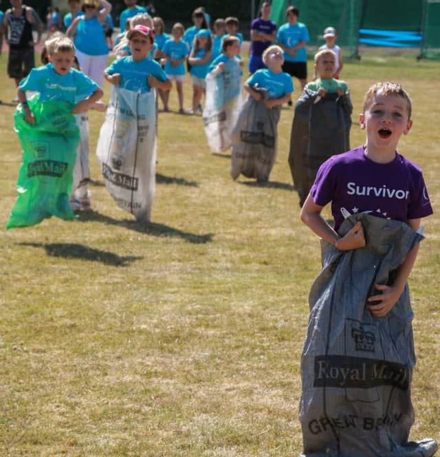 Relay for Life is open to the public and described as a 'mini festival'. Here participants enjoy retro sport races.