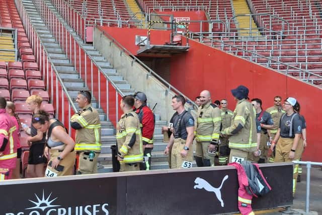 Firefighters entering the stadium