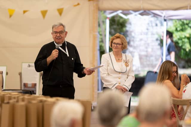 Canon Nick Ralph, chair of the Good Neighbours Network, introduces Mrs Annabelle Boyes, Deputy Lord Lieutenant for Hampshire, at the 50th anniversary event for The Good Neighbours Network