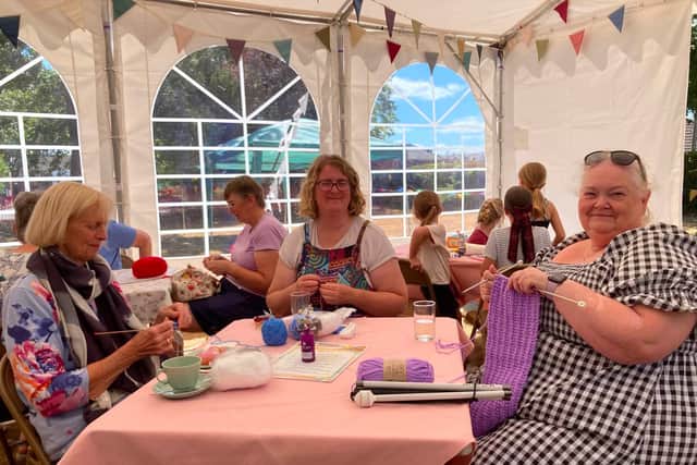 Knitting at the craft cafe during the summer celebration run by All Saints Denmead