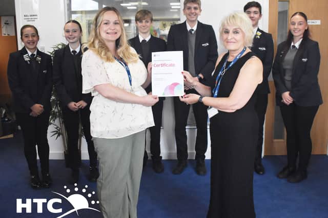 Photo: Subject Leader for MFL Andrea Landre (Front Left) and Headteacher Julie Summerfield (Front Right) proudly hold the newly awarded accreditation with HTC students.