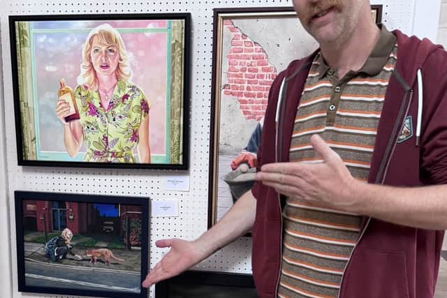 Miles Dewey is pictured here with his painting, called ‘The Charity of Venus’ showing the Parish Church of the Ascension Portsea in the background.