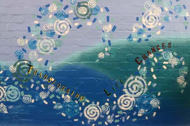 The Thinking Schools Academy's Trust's motto of 'Transforming Life Chances' displayed on the mural
