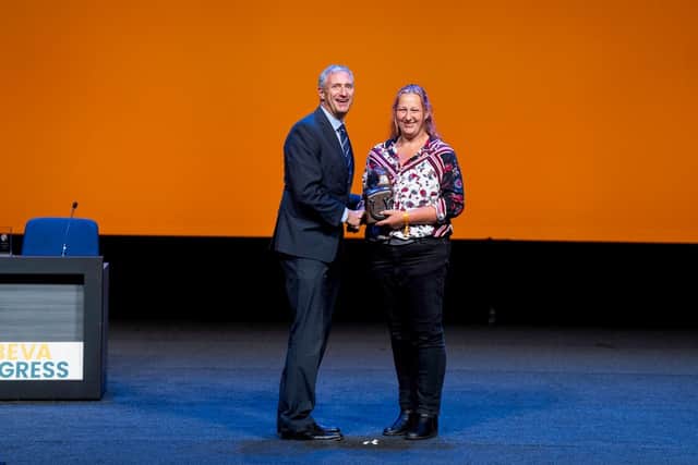 Veterinary nurse Phillippa Pritchard receives the BEVA Equine Welfare Award from Chris Burghes, chief executive of animal welfare charity Blue Cross which sponsored the category.