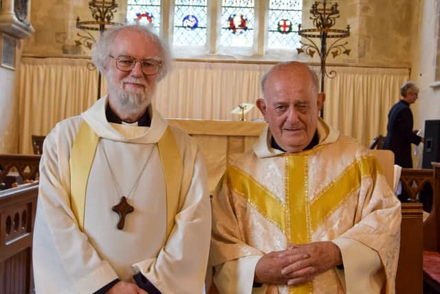 Former Archbishop of Canterbury Rowan Williams with retired priest Canon Terry Louden, at St Michael and All Angels Church, Chalton