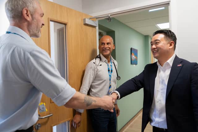 Havant MP Alan Mak meets a doctor in training, accompanied by GP partner Dr Abu Chinwala