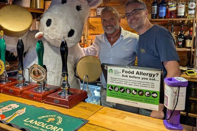 Charity mascot, Abbycorn with landlord, Dave Roseby and quiz host, Gary Parker
