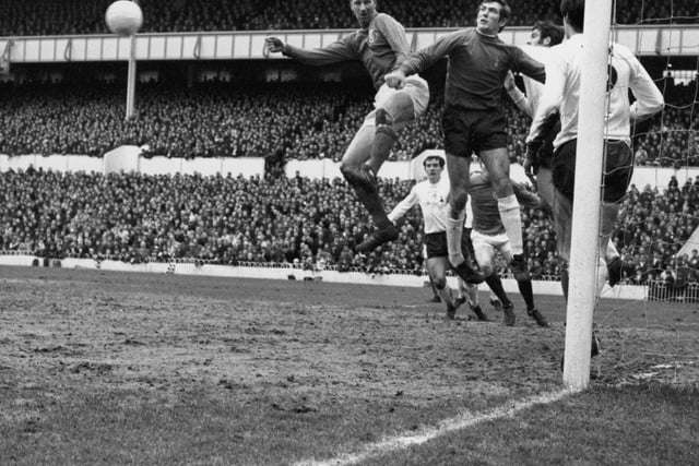 Spurs goalkeeper Pat Jennings punches away a header from Leeds centre half Jack Charlton during a game at Tottenham Hotspur's home ground White Hart Lane, on January 18 1969. Photo by Keystone/Getty Images.