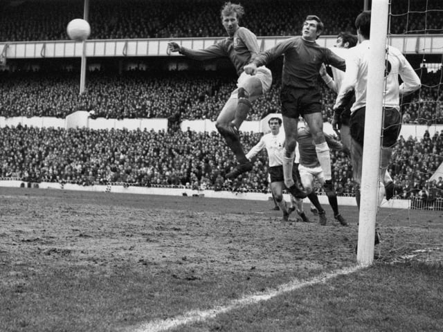 Spurs goalkeeper Pat Jennings punches away a header from Leeds centre half Jack Charlton during a game at Tottenham Hotspur's home ground White Hart Lane, on January 18 1969. Photo by Keystone/Getty Images.