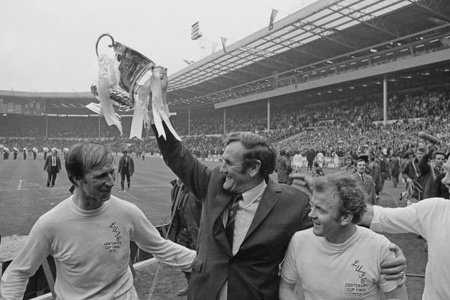 Chalrton, left, with boss Don Revie, Billy Bremner and Paul Reaney after Leeds United had won the FA Cup against Arsenal in May 1972. Photo by Express/Hulton Archive/Getty Images.