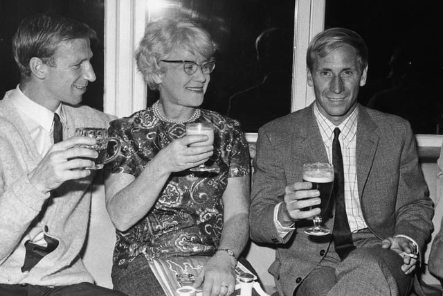 Jack and Bobby Charlton and their mother, Elizabeth, celebrating England's World Cup semi final victory over Portugal at the team hotel in Hendon, on July 27, 1966. Photo by Keystone/Hulton Archive/Getty Images.