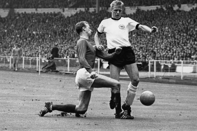 Charlton tackling West Germany's Held, during the World Cup Final at Wembley on July 30, 1966. Photo by Central Press/Getty Images.