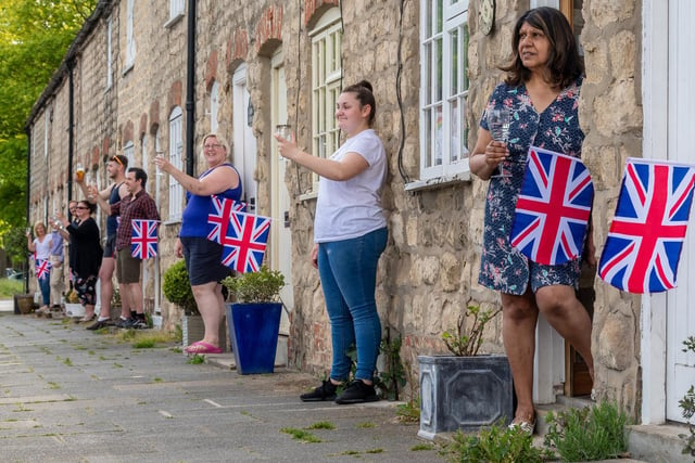 A number of residents in Old Malton, Malton, North Yorkshire, came out of their homes today at 3pm to stand together and raise a glass.
