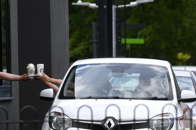 Drivers pick up their drive-through coffee at Starbucks, which has reopened branches across Yorkshire for drive-through and delivery. Photo: Jonathan Gawthorpe