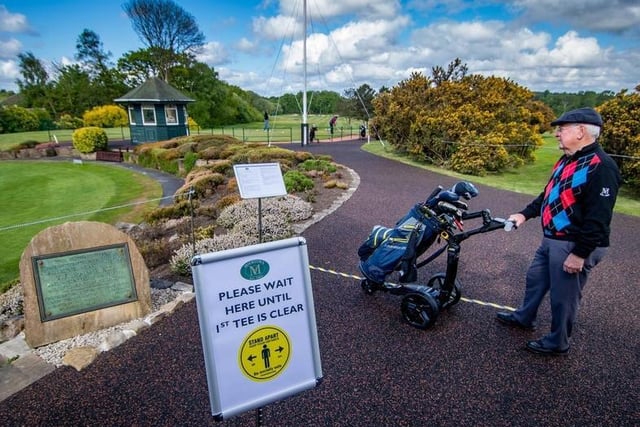 Golfers wait to tee off - but social distancing measures are in place at Moortown Golf Club, after some sports and leisure facilities were allowed to reopen