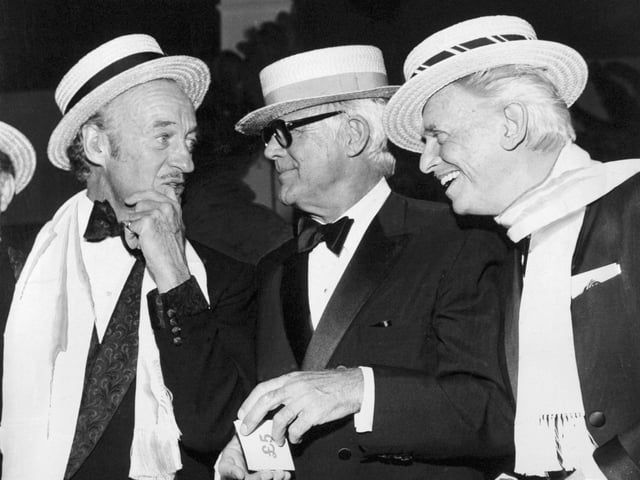 The Roaring Twenties Ball at the Queens Hotel. Pictured in conversation are Hollywood actors David Niven, Cary Grant and Douglas Fairbanks Junior.