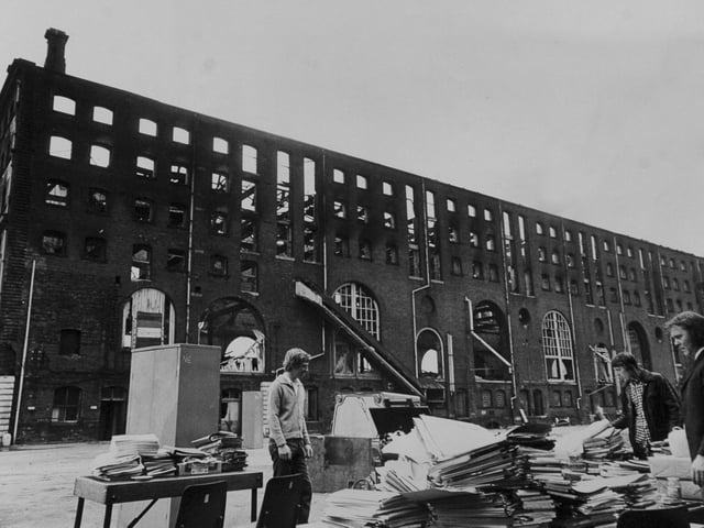 This is all that remains of the office effects from a fire which gutted warehouse in Marsh Lane. The men are employees of National Carriers Ltd., who had an office in the building.