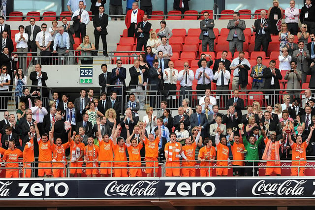 The Blackpool squad scaled the famous Wembley steps to lift the trophy