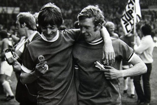 Allan Clarke and Mick Jones, wearing Juventus shirts, look at their winners medals after the 1971 Inter City Fairs Cup Final.
