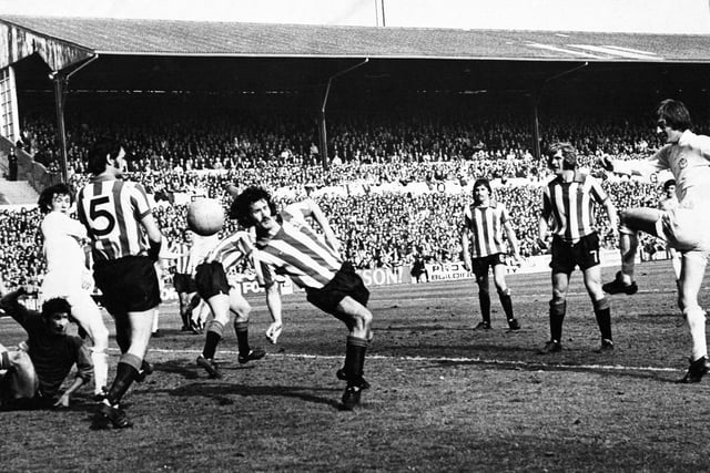 Allan Clarke crashes a shot past the Sheffield United defence at Elland Road.